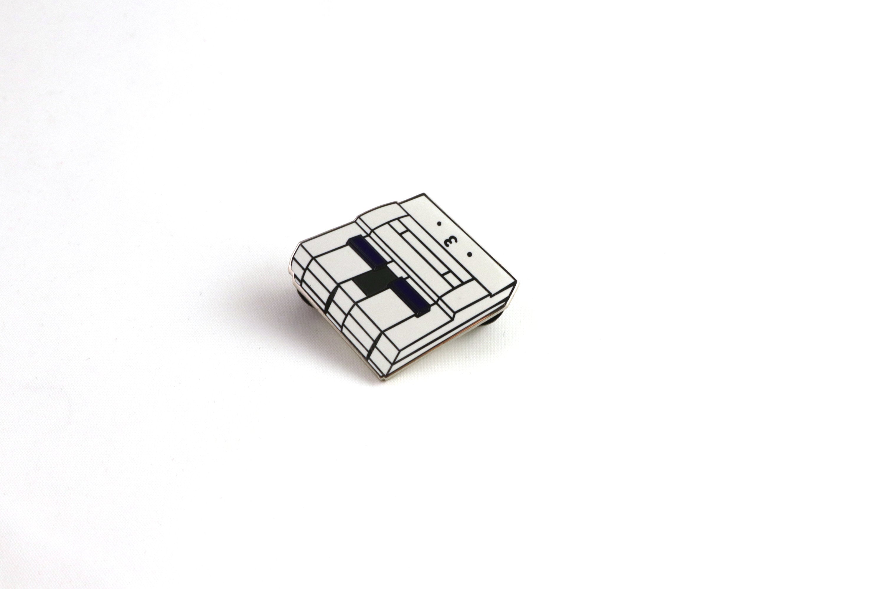 Gray SNES Console Hard Enamel Pin on White Background