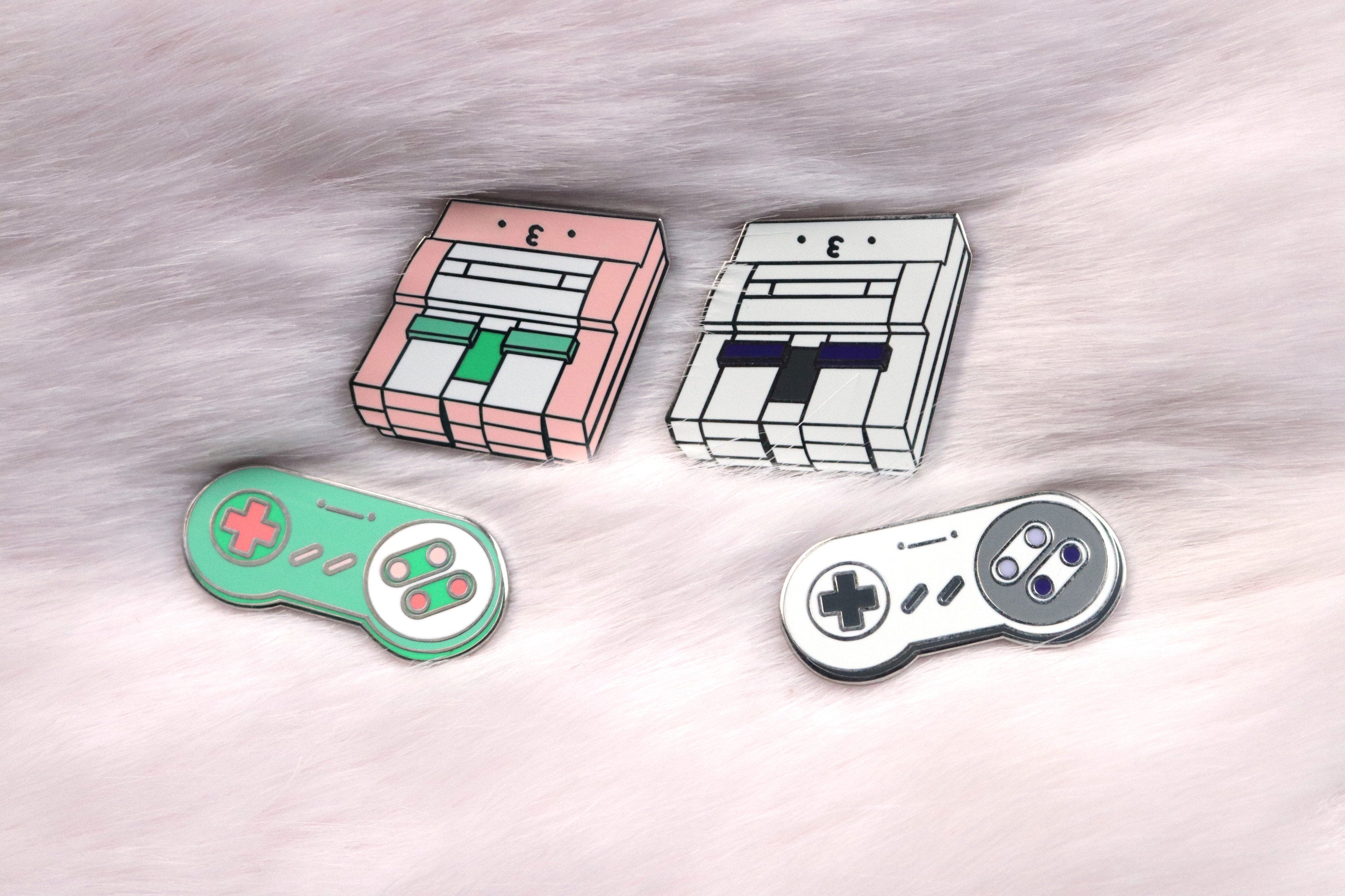 Pink and Gray SNES Consoles and Controllers on Pink Fur Background