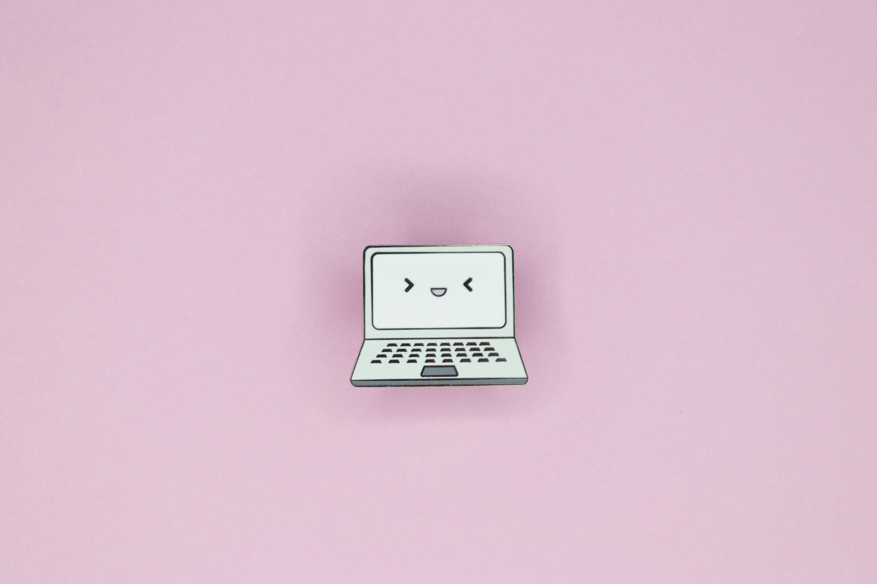 Gray Laptop Hard Enamel Pin on Pink Background